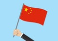 China waving flag. Hand holding Chinese flag. Red national symbol with yellow stars. Vector illustration Royalty Free Stock Photo
